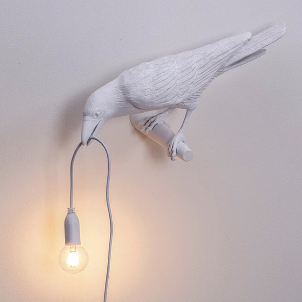 Hanging E14 bulb socket held in the bird's beak