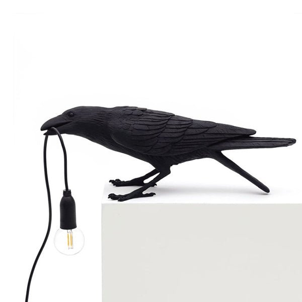 Black resin raven bird lamp holding an E14 bulb socket