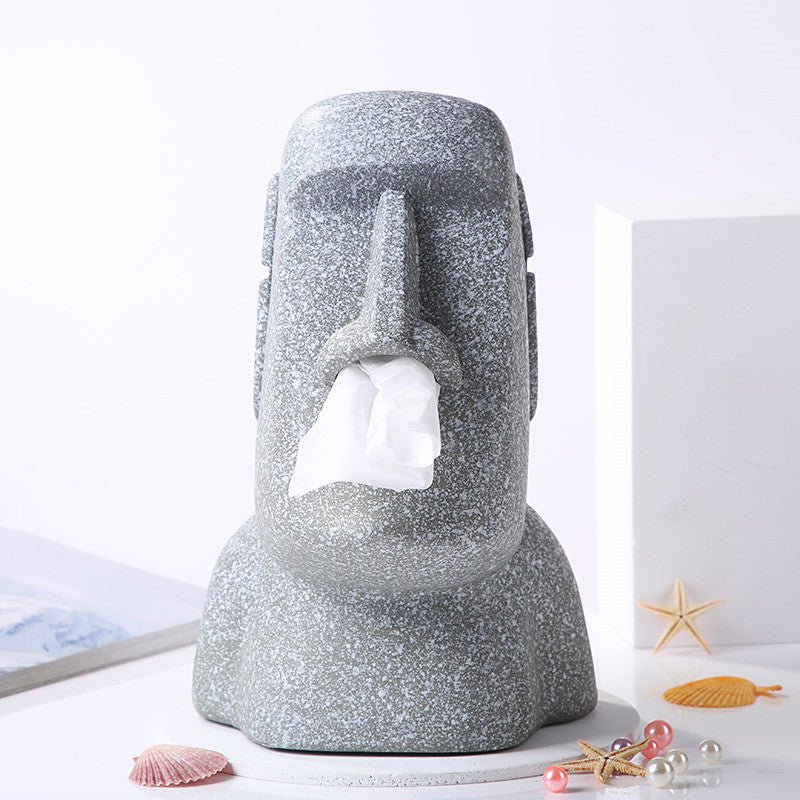 Grey Moai tissue box holder with tissue dispensing from the mouth