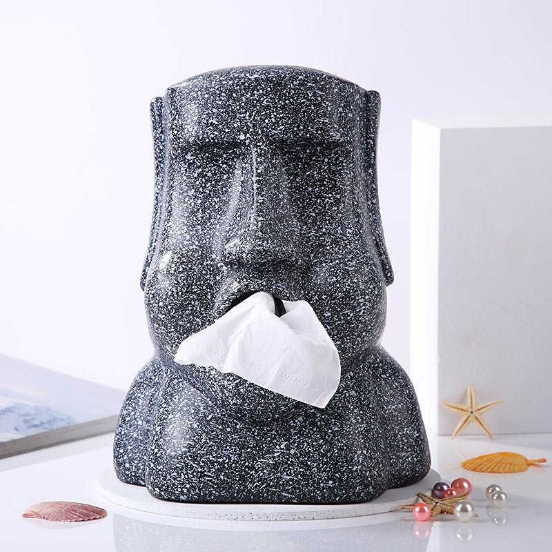 Black Moai tissue box holder with tissue dispensing from the mouth