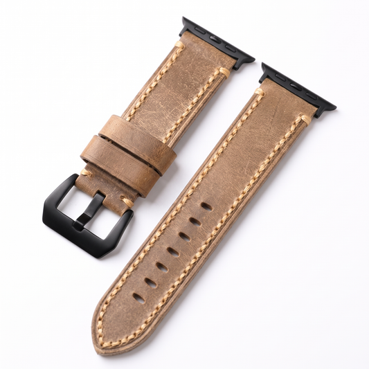 Brown stitched leather Apple Watch band with black buckle and connectors on a white background