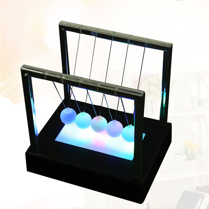 Newton's Glowing Balls Swing - Office Decor Meets Science