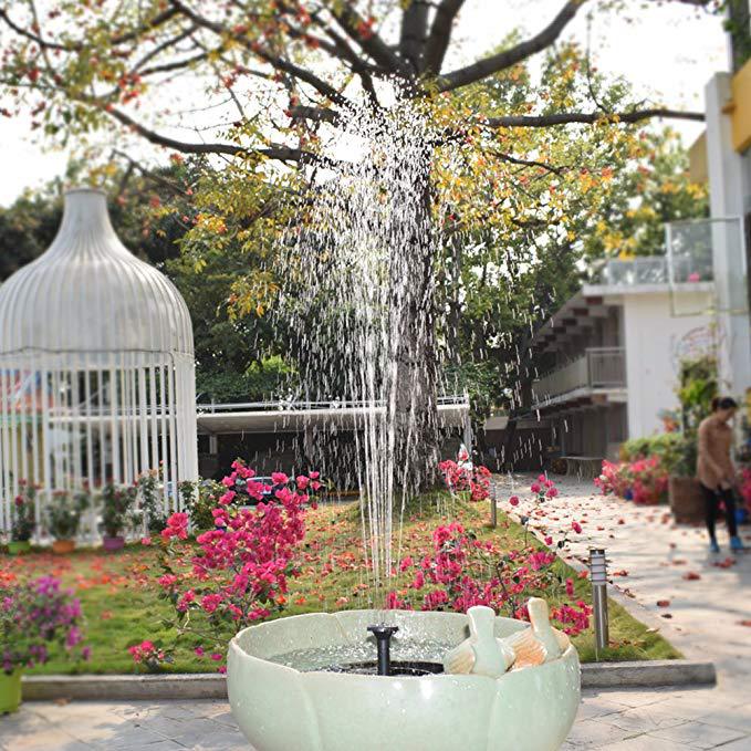 Floating fountain in a decorative garden pond